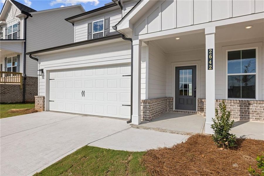 Front exterior of a new home in The Estates at Gainesville Township, Gainesville, GA, highlighting curb appeal (Image 7).