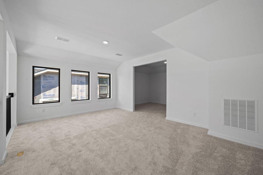 Another view of the gameroom that leads into a huge media room!