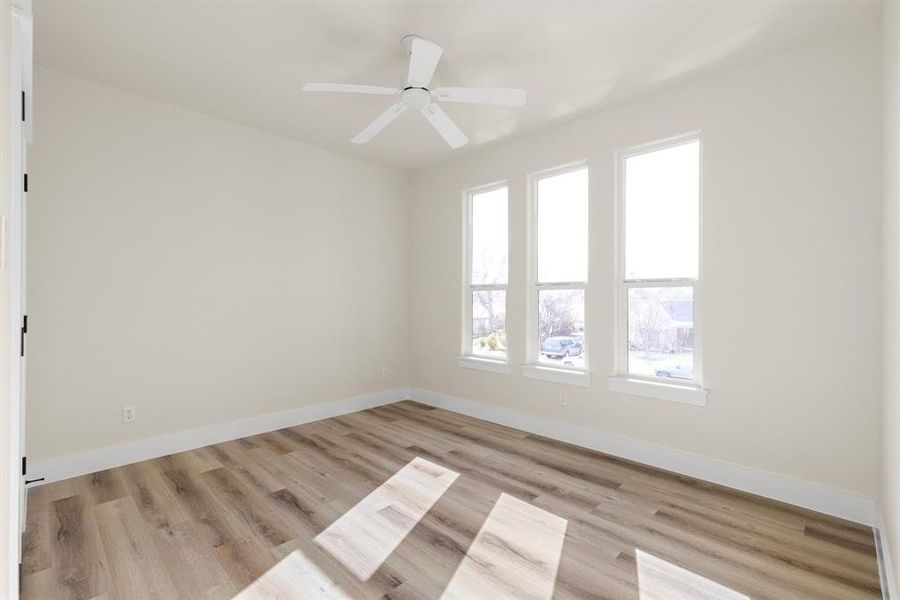 Spare room featuring light hardwood / wood-style flooring and ceiling fan