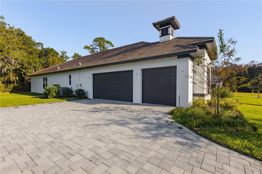 Front exterior of a new home in Toscana, Palm Coast, FL, highlighting curb appeal (Image 22).
