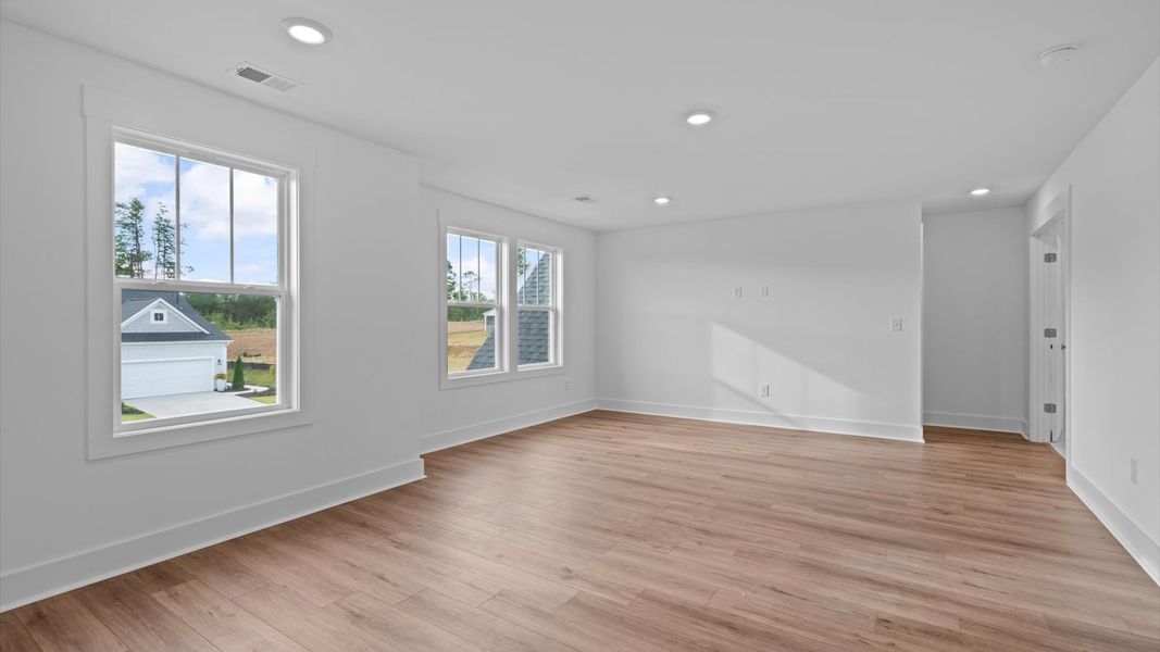 Hardwood flooring enhances the versatility of this elegant upper-level loft space