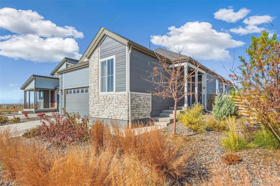 Front exterior of a new home in Legato, Commerce City, CO, highlighting curb appeal (Image 9).