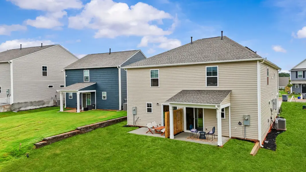 Exterior details and patio area of a home in Champions Village at Cherry Hill, Pendleton (Image 33).