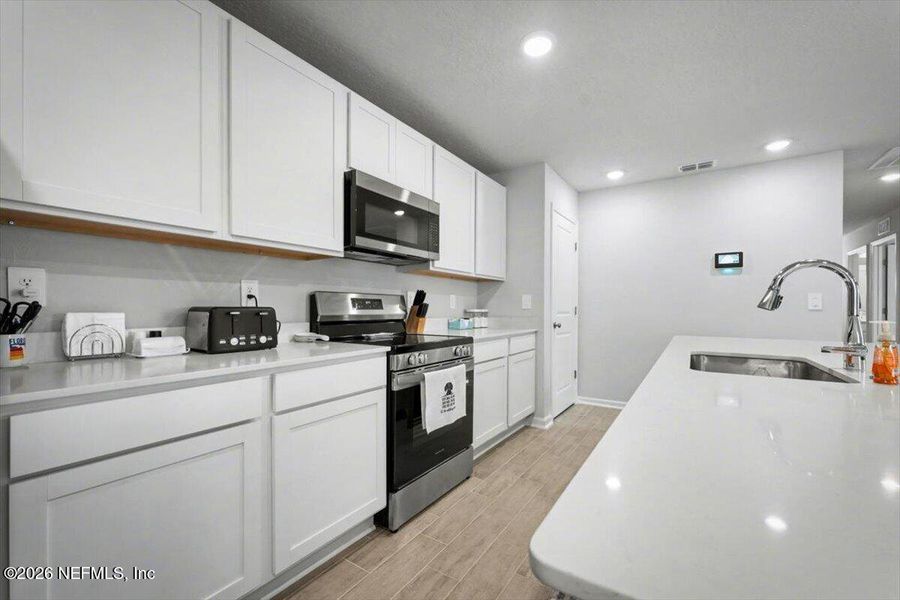 Furnished interior view inside a new home in Kings Landing, Jacksonville (Image 13).