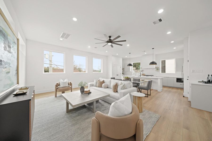 An opposite view of the family room which moves effortlessly into the kitchen creating a welcoming space where conversations and gatherings flow naturally from one area to the next. An opposite view of the family room which moves effortlessly into the kitchen creating a welcoming space where conversations and gatherings flow naturally from one area to the next.