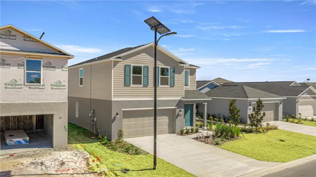 Front exterior of a new home in Millwood, Ocala, FL, highlighting curb appeal (Image 2). Front exterior of a new home in Millwood, Ocala, FL, highlighting curb appeal (Image 2).