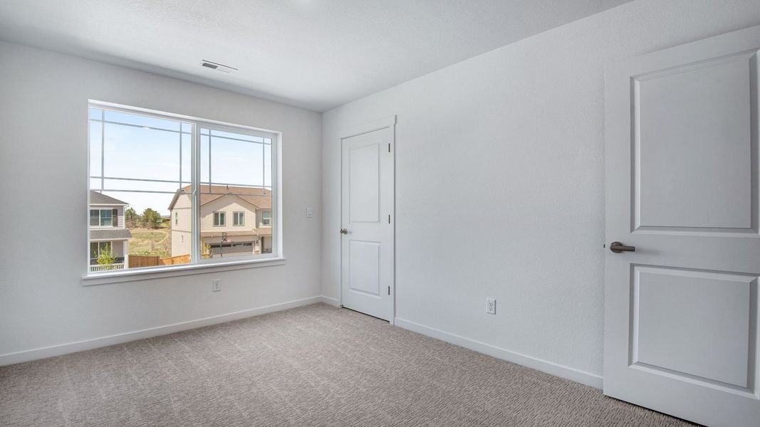 Spacious, unfurnished interior of a new home in Trails at Crowfoot, Parker (Image 42).