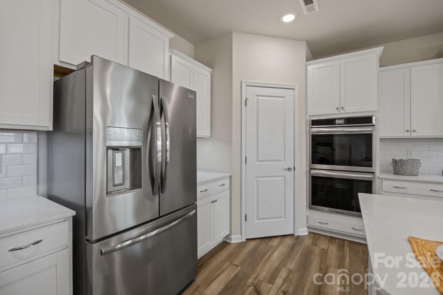 Top of the line Frigidaire Gallery Appliances! AND a large well-lit shelved pantry behind this center door.