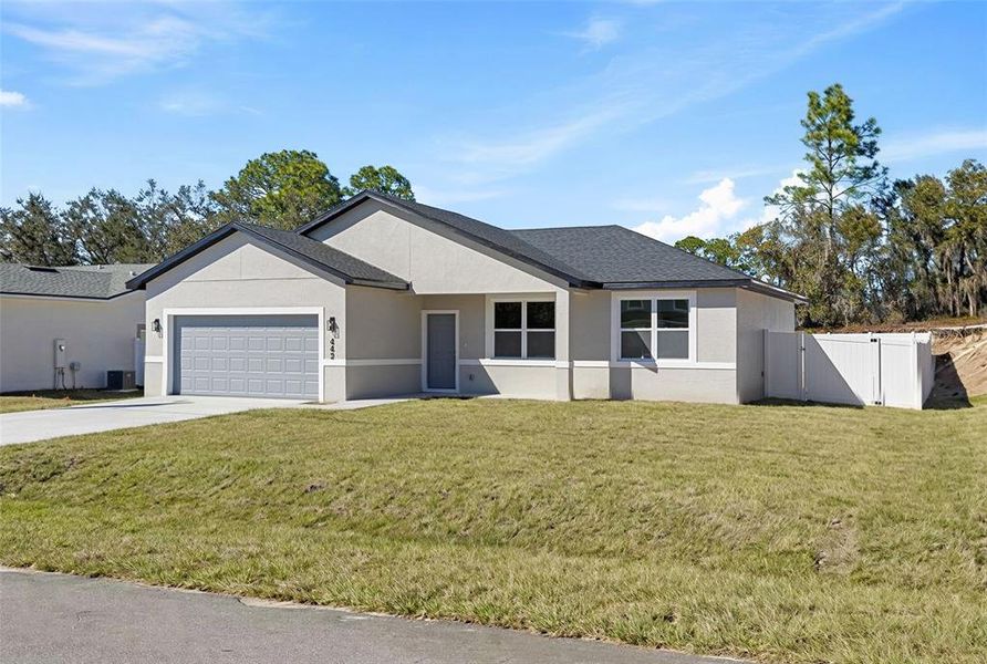 Front exterior of a new home in , Poinciana, FL, highlighting curb appeal (Image 2). Front exterior of a new home in , Poinciana, FL, highlighting curb appeal (Image 2).
