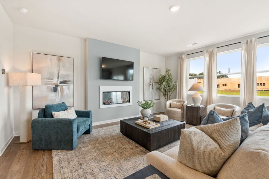 A living room with a large window. A living room with a large window.