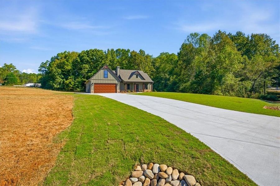 Front exterior of a new home in , Temple, GA, highlighting curb appeal (Image 2). Front exterior of a new home in , Temple, GA, highlighting curb appeal (Image 2).