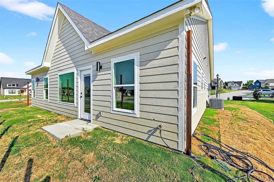 Front exterior of a new home in , Sherman, TX, highlighting curb appeal (Image 16).