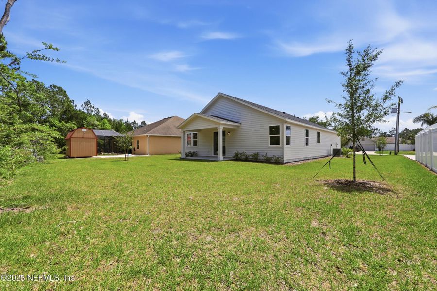 Exterior details and patio area of a home in Palm Coast Homes, Palm Coast (Image 31).