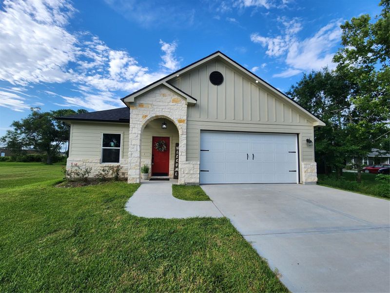 Front exterior of a new home in , West Columbia, TX, highlighting curb appeal (Image 2).
