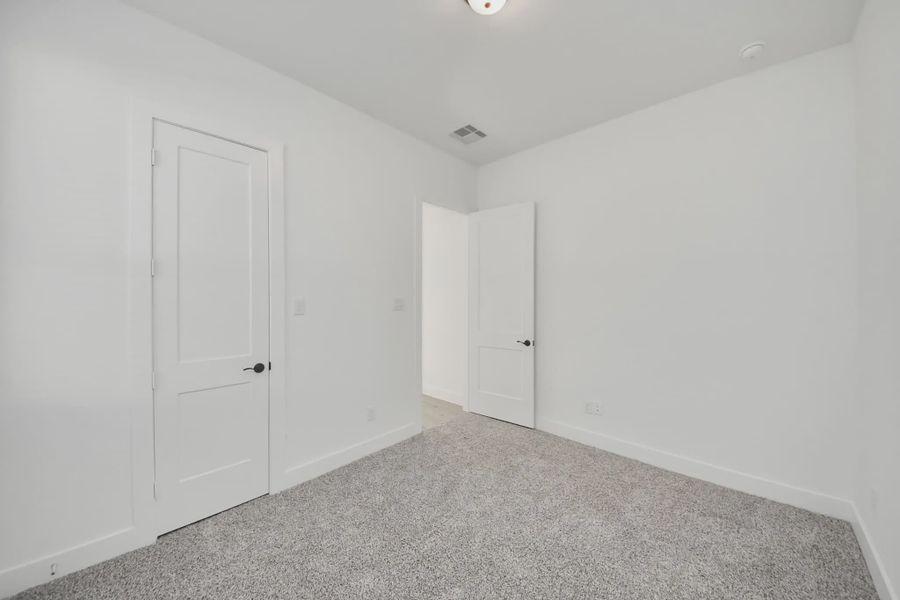Representative unfurnished interior of a home built from the Bonneville by Chesmar Homes in Meridiana 50's and 60's, Manvel (Image 34).