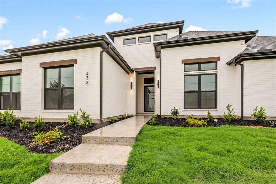 Front exterior of a new home in NorthGlen, Haslet, TX, highlighting curb appeal (Image 1). Front exterior of a new home in NorthGlen, Haslet, TX, highlighting curb appeal (Image 1).