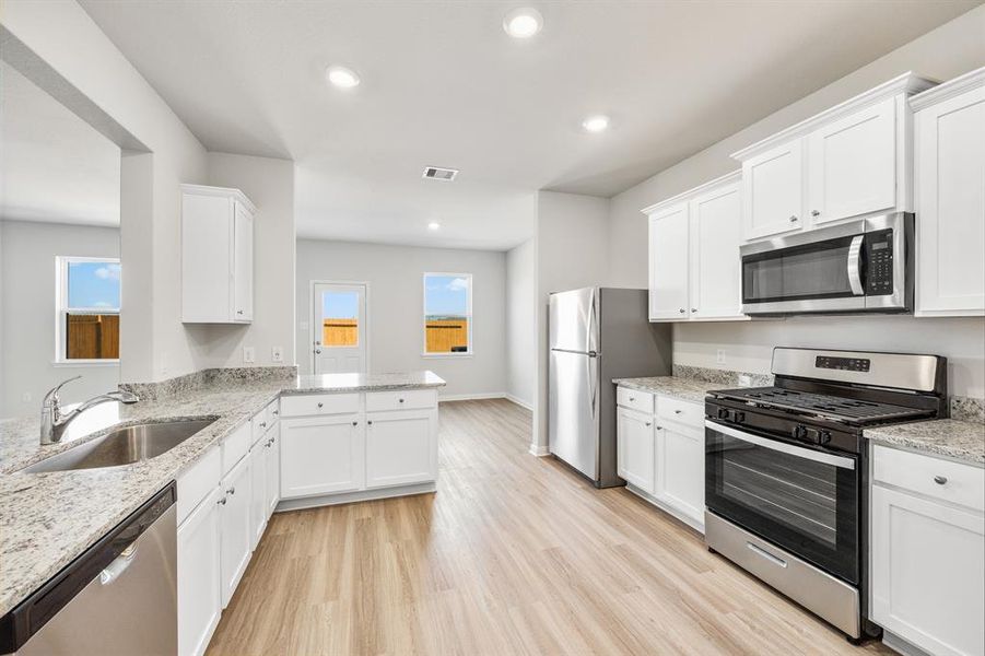 Kitchen with upgraded Whirlpool kitchen appliances.