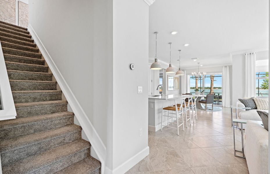 Stairs to the loft featuring a bed and bath