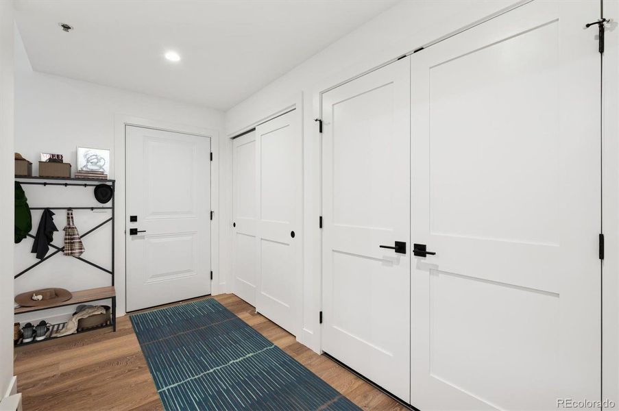 *virtually staged* ttached garage with entry to mudroom and third bedroom