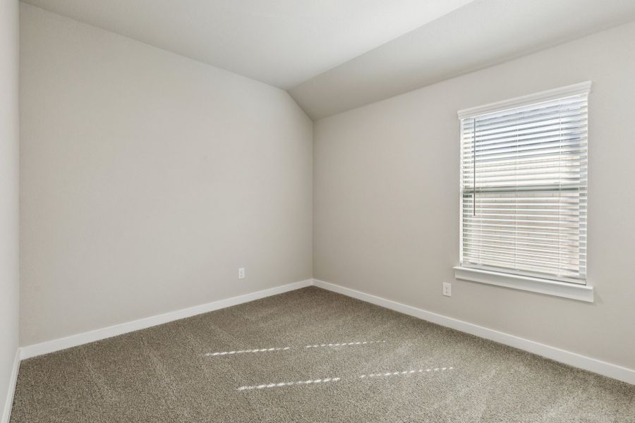 Bedroom in the Emmy II home plan by Trophy Signature Homes - REPRESENTATIVE PHOTO Bedroom in the Emmy II home plan by Trophy Signature Homes - REPRESENTATIVE PHOTO