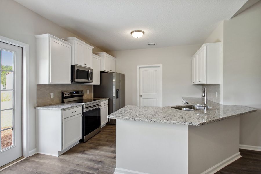 Representative furnished interior of a home built from the The Stafford by RTS Homes in Doctor's Creek, Ludowici (Image 15).