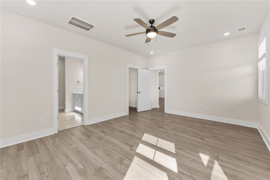 Bright and airy room with durable flooring, ready