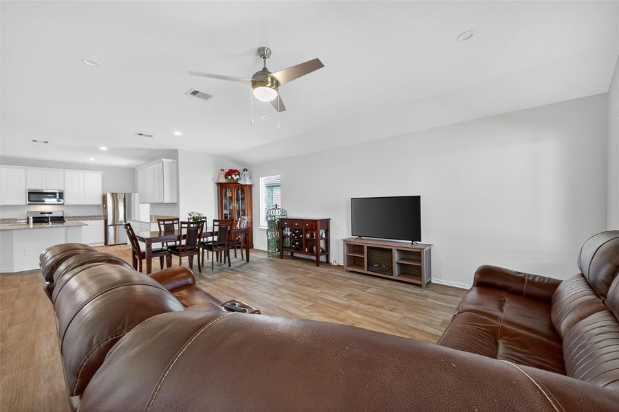 Designer finishes, elegant flooring, and sophisticated architectural touches elevate the home’s aesthetic.