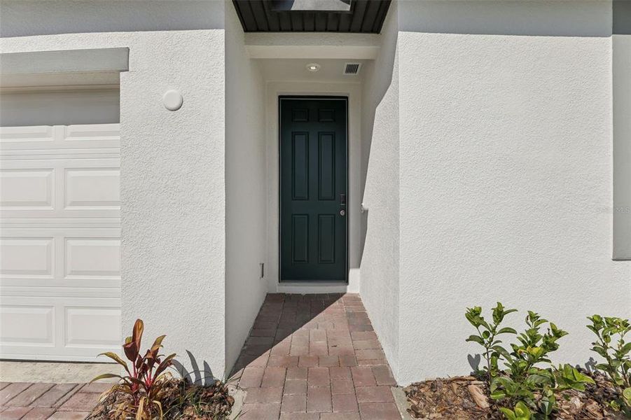 Exterior details and patio area of a home in Lawson Dunes - Signature Series, Haines City (Image 22).