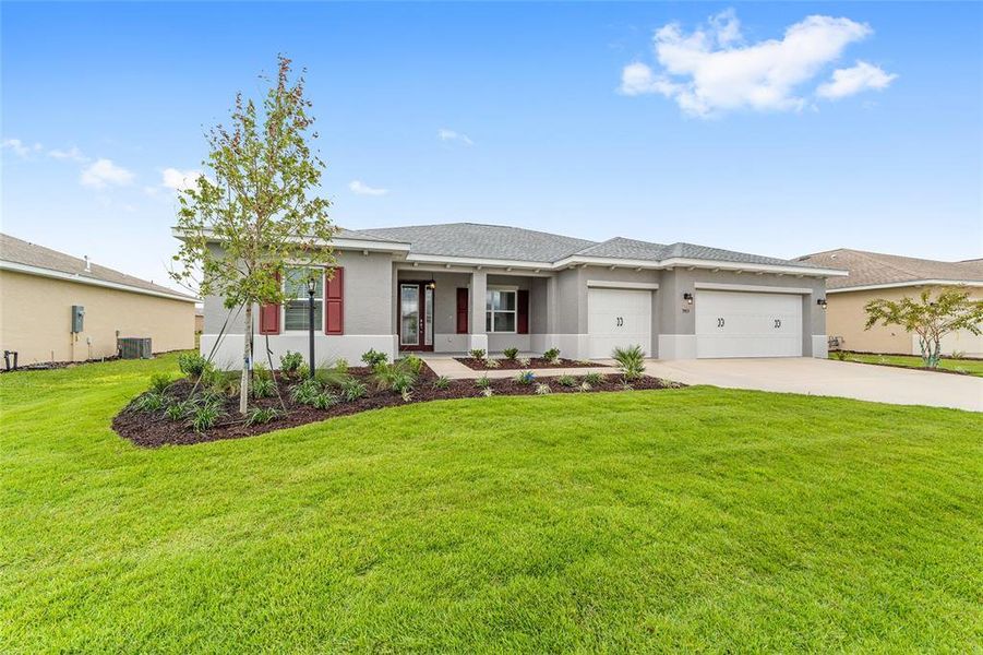 Front exterior of a new home in On Top of the World Communities, Ocala, FL, highlighting curb appeal (Image 24). Front exterior of a new home in On Top of the World Communities, Ocala, FL, highlighting curb appeal (Image 24).