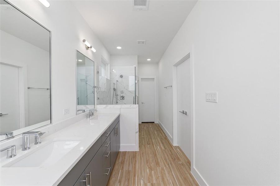 Primary Bath with Double Sinks With Modern Finishes Primary Bath with Double Sinks With Modern Finishes