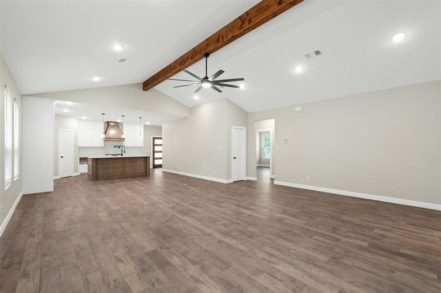 Unfurnished living room featuring dark wood finished floors, recessed lighting, and a ceiling fan