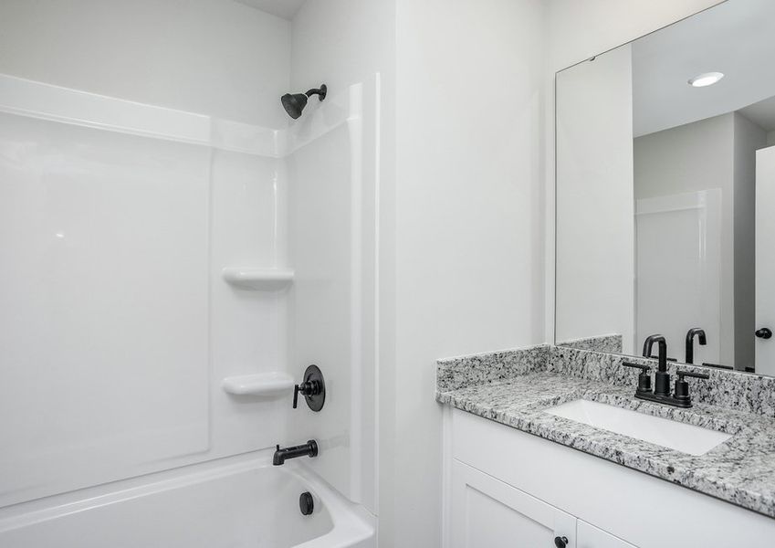 Secondary bathrooms have luxurious finishes.