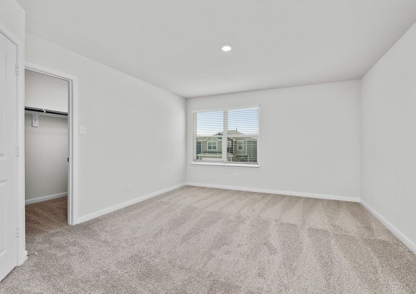 The master bedroom is spacious and has a large window. The master bedroom is spacious and has a large window.