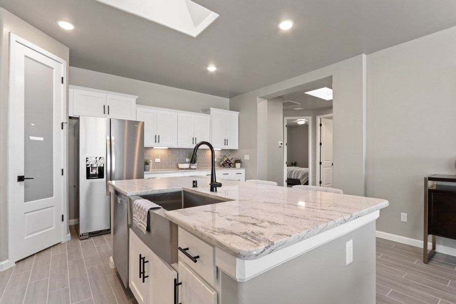 Representative furnished interior of a home built from the Pershing by Hakes Brothers in Paseo Del Este, El Paso (Image 6).