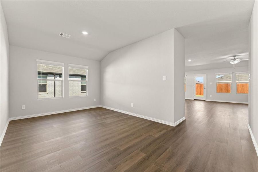 Flex room with lofted ceiling, plenty of natural light, and EVP flooring