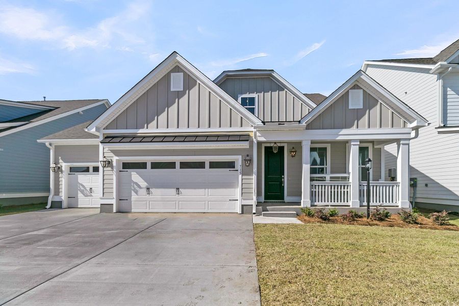 Front exterior of a new home in Tidewater at Lakes of Cane Bay, Summerville, SC, highlighting curb appeal (Image 1). Front exterior of a new home in Tidewater at Lakes of Cane Bay, Summerville, SC, highlighting curb appeal (Image 1).