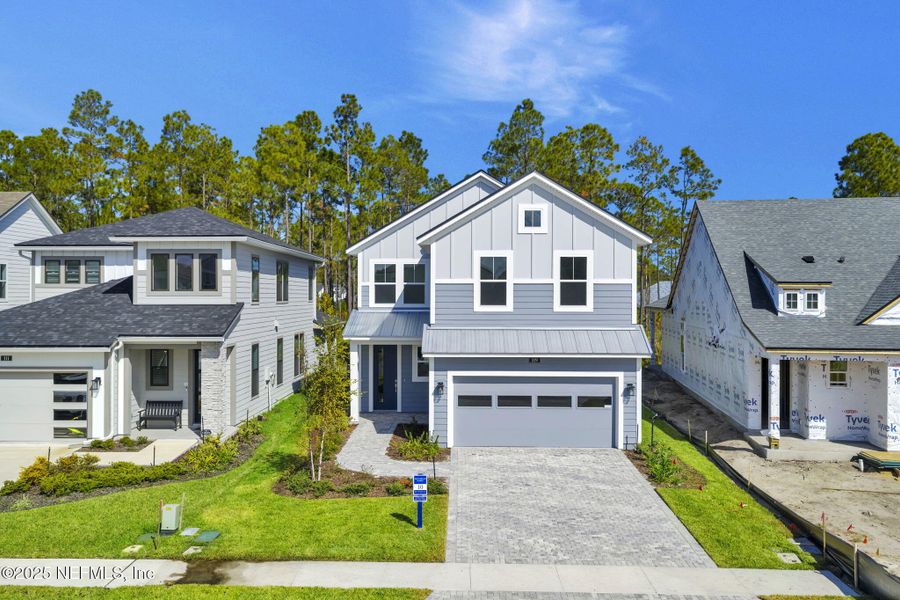 Front exterior of a new home in Crosswinds at Nocatee, Nocatee, FL, highlighting curb appeal (Image 28). Front exterior of a new home in Crosswinds at Nocatee, Nocatee, FL, highlighting curb appeal (Image 28).