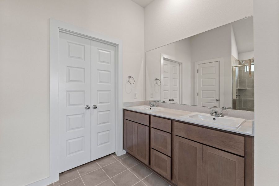 Primary Bath in the Quartz home plan by Trophy Signature Homes – REPRESENTATIVE PHOTO