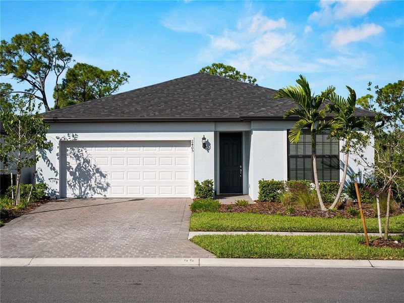 Front exterior of a new home in , North Port, FL, highlighting curb appeal (Image 24). Front exterior of a new home in , North Port, FL, highlighting curb appeal (Image 24).