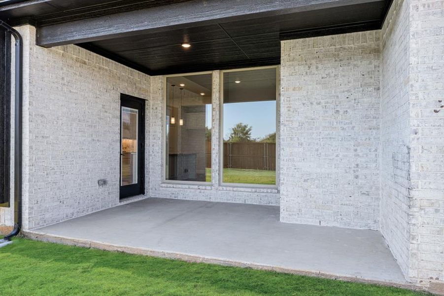 Exterior details and patio area of a home in Mockingbird Hills 60-65, Joshua (Image 3).