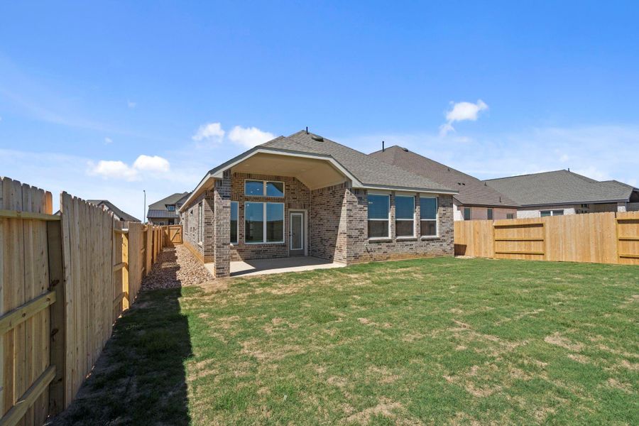 Exterior details and patio area of a home in Wildrye, Waller (Image 18).