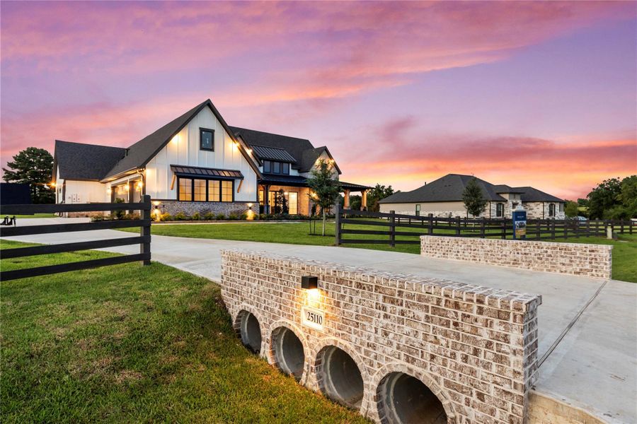 Front exterior of a new home in , Montgomery, TX, highlighting curb appeal (Image 23). Front exterior of a new home in , Montgomery, TX, highlighting curb appeal (Image 23).