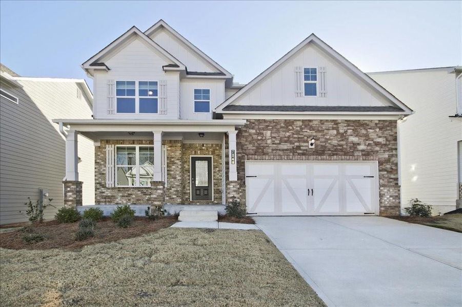 Front exterior of a new home in Clark Farms, Flowery Branch, GA, highlighting curb appeal (Image 1). Front exterior of a new home in Clark Farms, Flowery Branch, GA, highlighting curb appeal (Image 1).