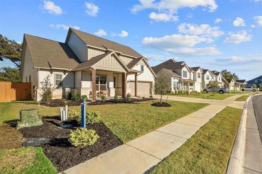 Stunning curb appeal with attractive architectural design, well maintained landscaping, two car garage, and covered front porch that is made for catching epic hill country sunsets.