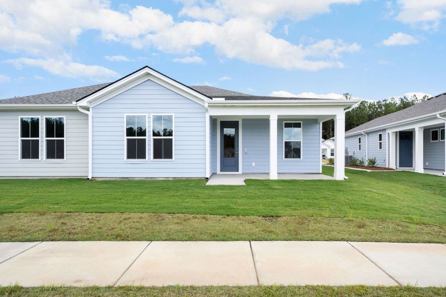 Front exterior of a new home in Sun City Hilton Head, Bluffton, SC, highlighting curb appeal (Image 22).