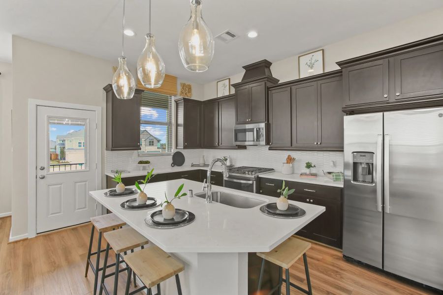 Representative furnished interior of a home built from the Summerhouse 2 by Chesmar Homes in Meridiana Townhomes, Iowa Colony (Image 9).