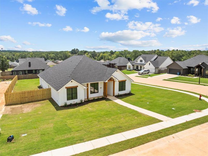 Front exterior of a new home in , Lindale, TX, highlighting curb appeal (Image 22).