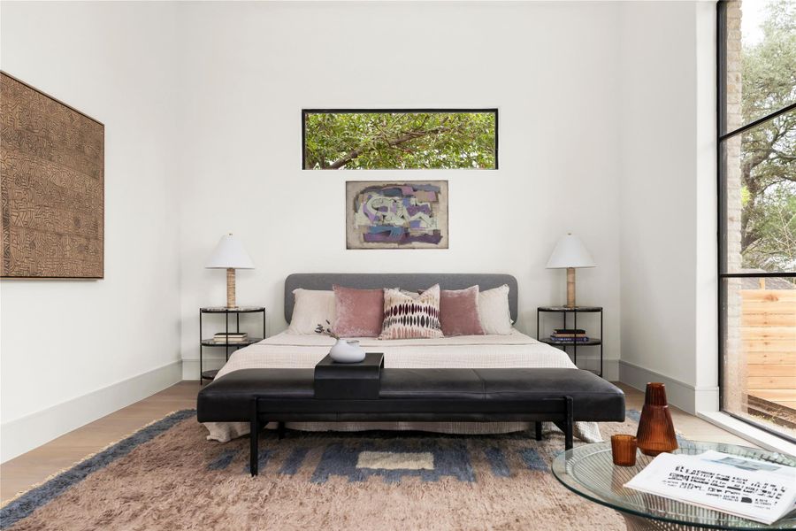 Bedroom featuring wood finished floors and baseboards