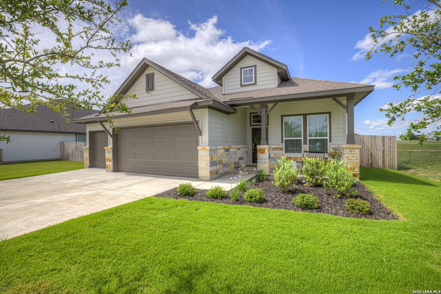 Front exterior of a new home in August Fields, New Braunfels, TX, highlighting curb appeal (Image 22).