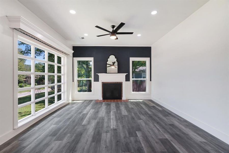living room with a fireplace, a ceiling fan, dark wood-style floors, and recessed lighting living room with a fireplace, a ceiling fan, dark wood-style floors, and recessed lighting
